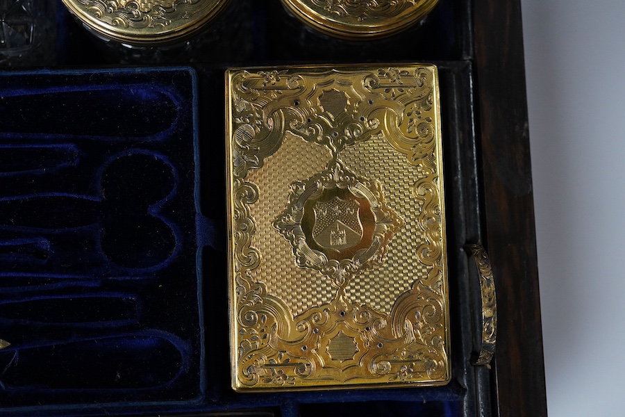 A Victorian brass mounted coromandel travelling toilet box(incomplete), with seven silver gilt lidded glass jars, four hallmarked for Thomas Johnson I, London, 1853 with one lacking glass base and one associated jar with